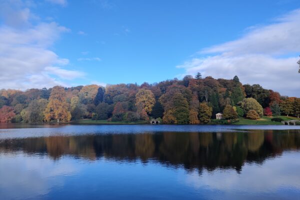 The lake and trees in autumn at Stourhead Gardens in Wiltshire England