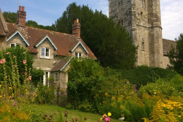 A pretty church tower and cottage