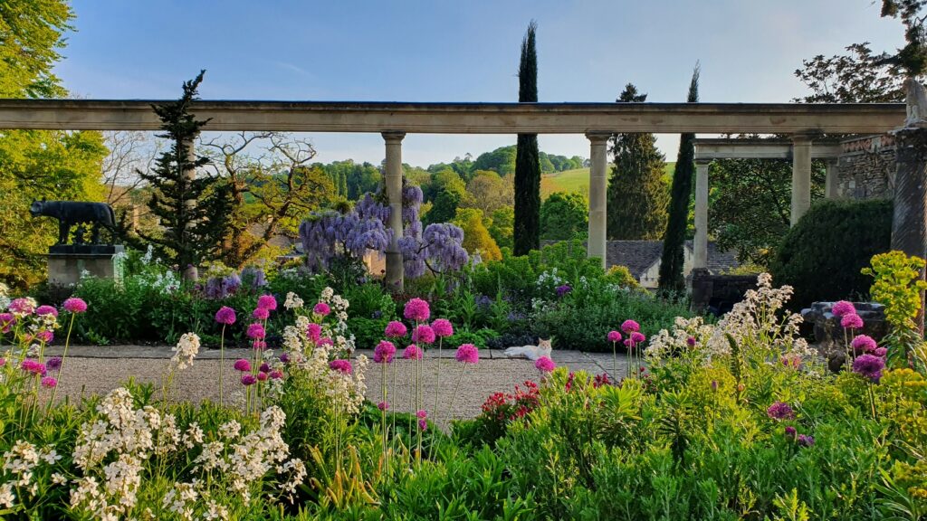 Iford Manor gardens in summer with beautiful flowers and blooms