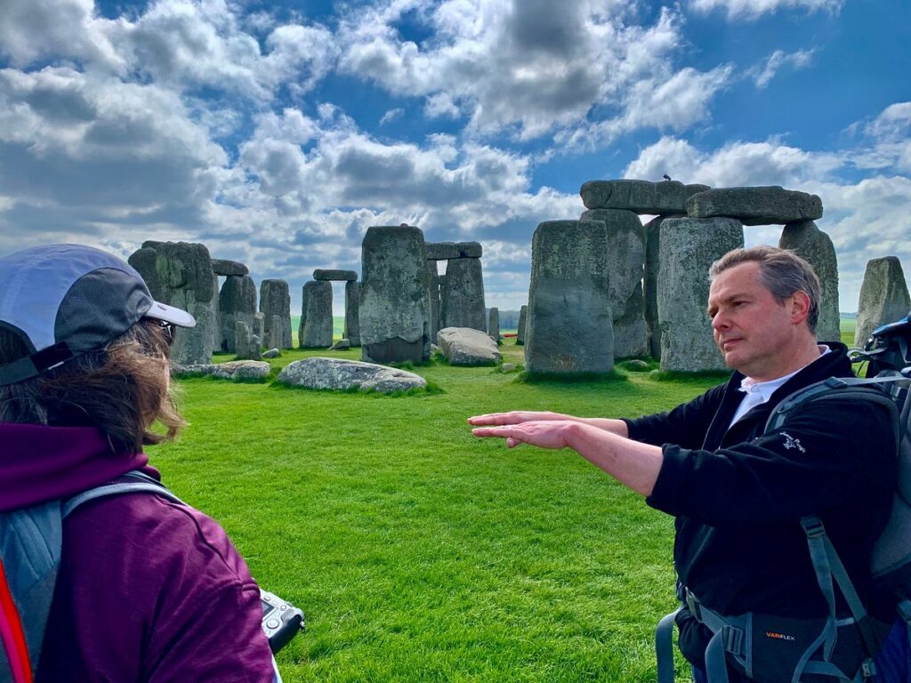 Drive and Stroll's private guide David Howell guiding a guest at Stonehenge, Wiltshire